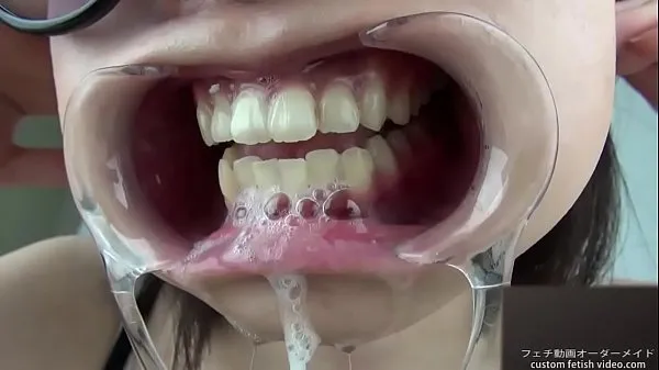 New A woman shows her gums and sputs saliva cool Videos